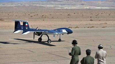 Technicians observe an aerial vehicle's performance. AFP