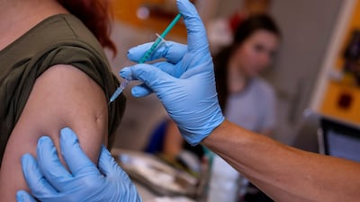 A woman received a Covid-19 vaccine Berlin, Germany, where experts say another lockdown may be needed if vaccinations do not accelerate quickly. Reuters