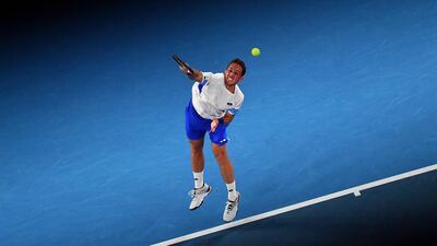 Spain's Roberto Carballes Baena serves against Novak Djokovic. AFP
