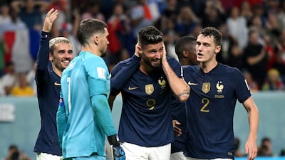 Olivier Giroud of France celebrates with teammates after scoring their fourth goal to equal Thierry Henry's record of 51 goals for his country in the World Cup Group D match against Australia at Al Janoub Stadium on November 22, 2022. Getty