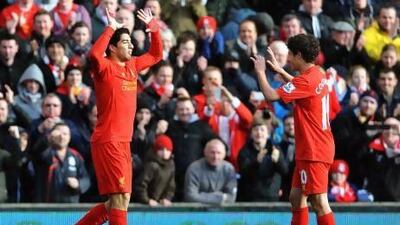 Luis Suarez edged the battle of the player of the year contenders as he scored and earned the match-winning penalty to eclipse Gareth Bale and keep Liverpool's slim top-four hopes alive.