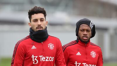 Alex Telles and Fred looking serious.