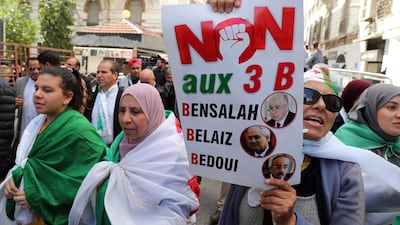 Algerian protester holds a banner railing against 'the three Bs': against interim president Abdelkader Bensalah, interior minister Tayeb Belaiz and prime minister Noureddine Bedoui. EPA