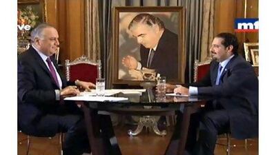 Former Lebanese prime minister Saad Hariri, right, during an interview with a Lebanese MTV broadcaster in Paris on Tuesday. EPA / DALATI AND NOHRA