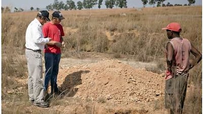 Petrus du Toit, left, the head of agriculture for Ridge Solutions, is overseeing work on a farming venture for the company.