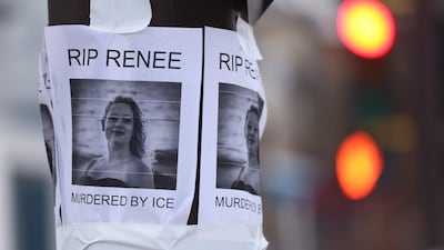 A picture is displayed at a makeshift memorial for Renee Good. AFP