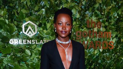 Nyong'o looked stylish in a black long-sleeved, deep v-neck gown, paired with a diamond drop pendant necklace and glittering choker. EPA