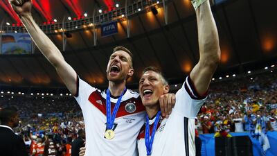 Arsenal may need Per Mertesacker, left, who was part of Germany’s World Cup-winning team, to help out in defence. Eddie Keogh / Reuters