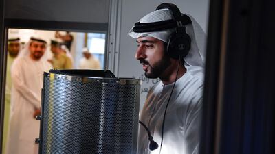 Sheikh Hamdan records a narration to a science lesson for Arabic-speaking children in 2018. The Crown Prince will also take to the airwaves on Emirates' in-flight entertainment. Courtesy: Wam
