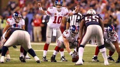 Quarterback Eli Manning, centre, is hoping to get his New York Giants team off to a faster start in the regular season this time around.