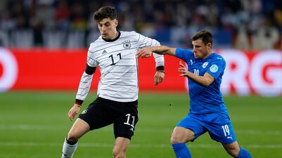 Kai Havertz holds off a challenge from Israel's Gavriel Kanichowsky. EPA