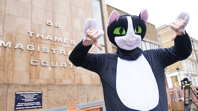 A person dressed as a cat outside Thames Magistrates' Court where West Ham defender Kurt Zouma was being sentenced for kicking his cat after being prosecuted by the RSPCA under the Animal Welfare Act. PA