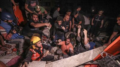 Firefighters race against time to find survivors. AFP