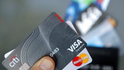 While US consumers are not keen to lean on credit cards, looser lending standards has seen borrowing rise. Photo: Associated Press