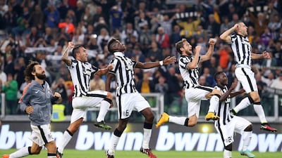 Juventus fans are hoping to see their team celebrate winning the European Cup on Saturday. Marco Bertorello / AFP
