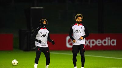 Liverpool's Trent Alexander-Arnold and Mohamed Salah during Champions League training at the AXA Training Centre, Liverpool. PA
