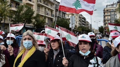 Faithfuls from Lebanon holding their national flag, gather outside of the church of Saint Dimitrios during the double celebration marking the Feast Day of Agios Dimitrios, the protector and Patron Saint of northern port city of Thessaloniki, along with the Liberation of Thessaloniki by the Greek Army in 1912, in Thessaloniki on October 25. AFP