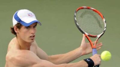 A shirtless Andy Murray demonstrates just how uncomfortable the Beijing weather conditions are for tennis players on the court.