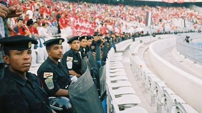 A heavy Egyptian police presence watches the crowd during the Al Ahly-Zamalek match in 2007.