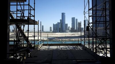 Above, a view of Reem Island from a construction site at Al Maryah Island. Aldar’s planned Shams Marina serviced apartment and apartment scheme was one of a number of projects signed off by the city’s Urban Planning Council. Delores Johnson / The National