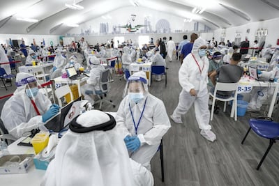 A laser screening centre for Covid-19 on the Dubai-Abu Dhabi border screens thousands of people every day. Antonie Robertson / The National