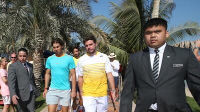 Rafael Nadal, left, and Stan Wawrinka arrive on Thursday at the Beach Rotana in Abu Dhabi for an appearance ahead of the Mubadala World Tennis Championship. Ali Haider / EPA