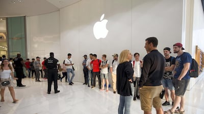 Apple fans join a line to get the new iPhone XS at the Apple store in Dubai Mall. Leslie Pableo / The National