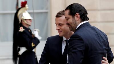 French President Emmanuel Macron and Saad al-Hariri, who has announced his resignation as Lebanon's prime minister, walk together at the Elysee Palace in Paris, France, November 18, 2017. Reuters