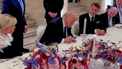 US President Donald Trump signs the Iran peace deal in Versailles. Photo: White House
