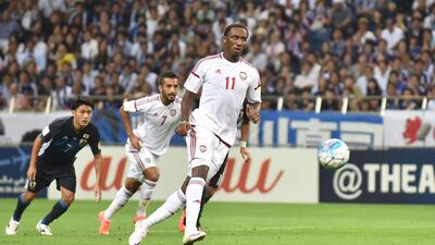 UAE's Ahmed Khalil scores a penalty kick against Japan at Saitama Stadium on Thursday. Kazuhiro Nogi / AFP