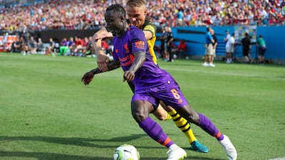 Borussia Dortmund's Amos Pieper defends Liverpool's Naby Keita. Reuters