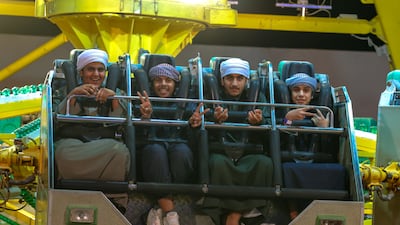 Rides include a Ferris wheel and bumper cars