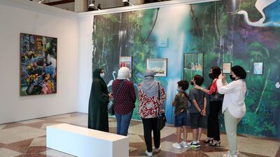 Visitors at the Farah Al Qasimi exhibition. Pawan Singh / The National
