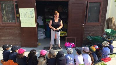 Children at American School Dubai learn about gardening tools. Courtesy Home Grown Children’s Eco Nursery
