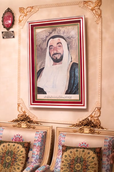 A portrait of Sheikh Zayed takes pride of place in the home of businessman Saddque Al Khaja. Reem Mohammed/The National