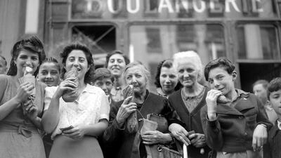 Parisians in 1944 buying bread after years of living of on rations. AFP