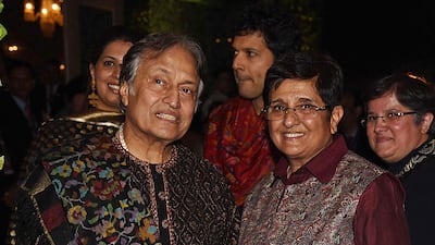 Indian classical Sarod player Amjad Ali Khan (L) and retired Police Service officer and politician Kiran Bedi (R). Photo: AFP