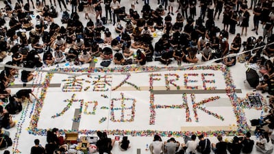 Anti-government protesters gather during a demonstration inside a mall in Sha Tin district in solidarity with the student protester who got shot by police with live ammunition in Hong Kong, China October 2, 2019. REUTERS/Athit Perawongmetha TPX IMAGES OF THE DAY