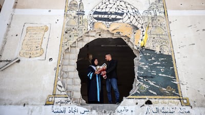 Palestinian researcher Nevin Yassin 'defended' her master's thesis from the ruins of Al Azhar University in Gaza city in May. Getty.
