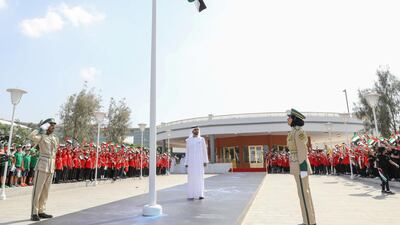 Attendees salute the flag.