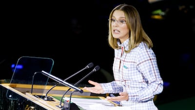 Millie Bobby Brown, wearing a lilac houndstooth belted two-piece by Thom Brown, speaks on Universal Children's Day at the United Nations headquarters in New York City on November 20, 2019. EPA