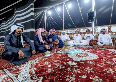 Men of the Dawasir tribe from Saudi Arabia relax after a victory at the Al Dhafra Festival in Abu Dhabi, UAE. Victor Besa / The National