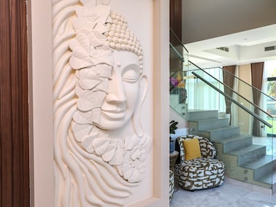 A Buddha mural in the entrance to the villa. Victor Besa / The National