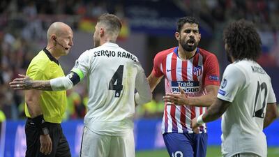 Ramos remonstrates with Polish referee Szymon Marciniak, left, as Marcelo and Costa look on. AFP
