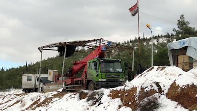Syrian maintenance workers at the entrance of Ain Al Fijeh water source near Damascus on January 28, 2017. AFP
