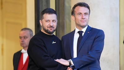 French President Emmanuel Macron, right, welcomes Ukrainian President Volodymyr Zelenskyy at the Elysee Palace on May 14. AP