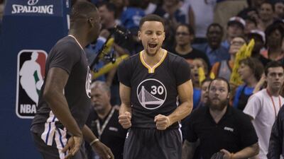 Stephen Curry of the Golden State Warriors celebrates after tying the game against the Oklahoma City Thunder during the fourth period of a NBA game at the Chesapeake Energy Arena on February 27, 2016 in Oklahoma City, Oklahoma. The Warriors won 121-118 in overtime. AFP