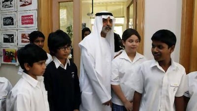 Sheikh Nahyan Bin Mubarak walks along with the pupils as they make a brief tour of the premises at Uptown High School in Al Ghusais Muhaisnah 4.