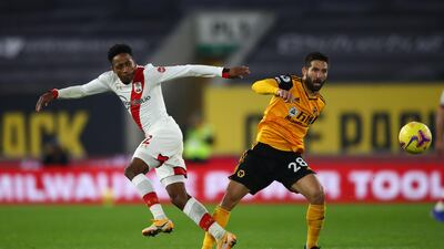 Southampton's Kyle Walker-Peters (left) and Wolverhampton Wanderers' Joao Moutinho battle for the ball. PA