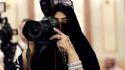 Above, a female Saudi journalist at work in Riyadh. Saudi officials are clarifying misconceptions about male guardianship, which is often confused with cultural habits. Hasan Jamali / AP Photo